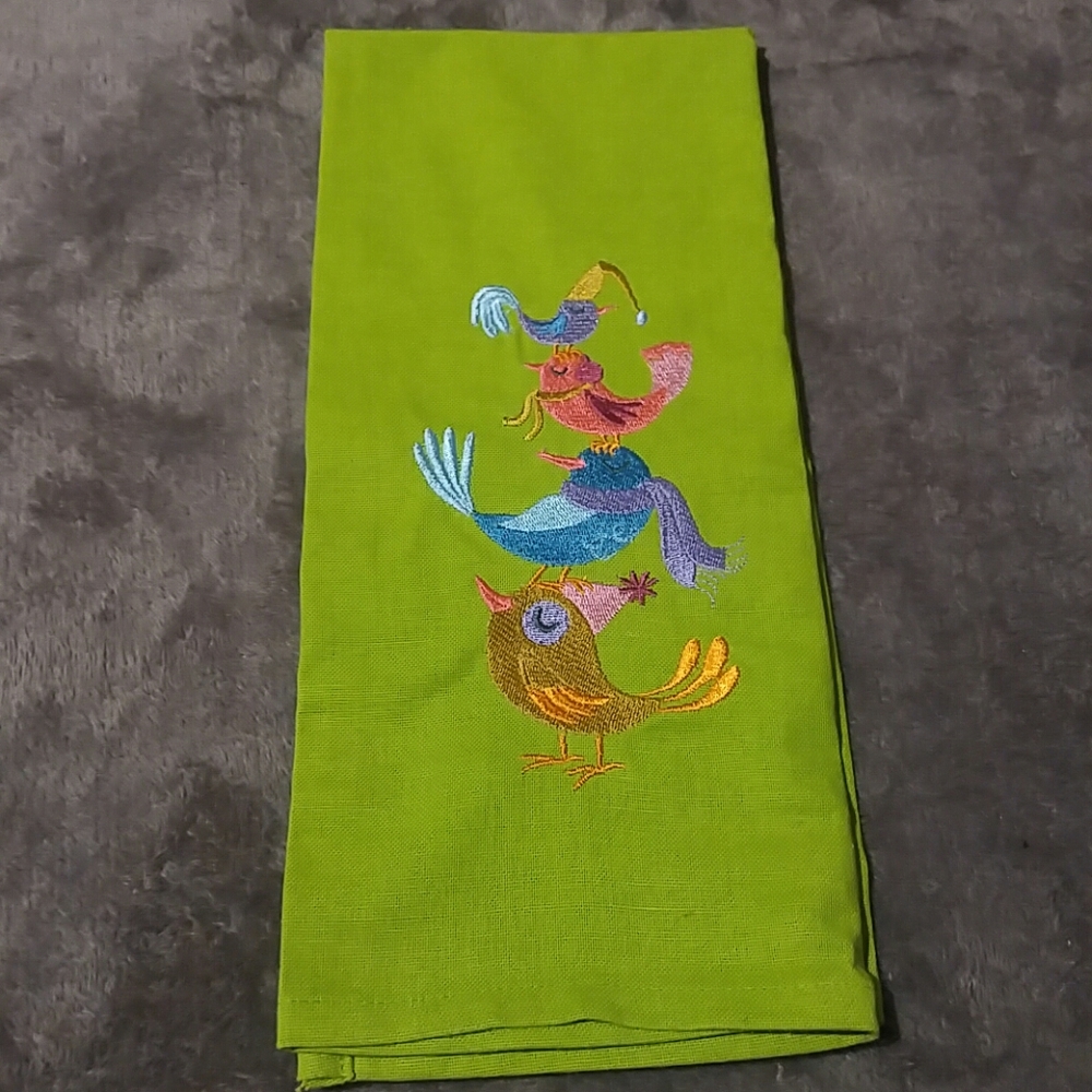 Green tea towel with pink purple blue orange birds